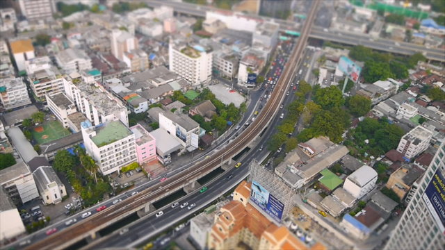 Speed up of minature high view of traffic and city at Bangkok
