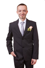 Groom holding hand in his pocket