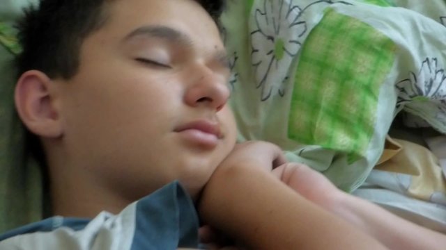 The young man peacefully sleeping