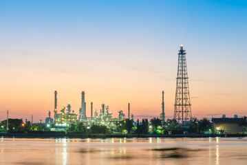 Oil refinery along the river at the early morning light.