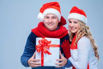 Lovely christmas couple holding presents