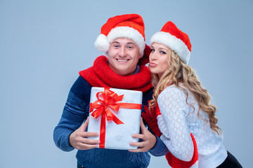 Lovely christmas couple holding presents