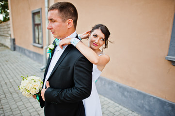 wedding couple background stone wall with windows