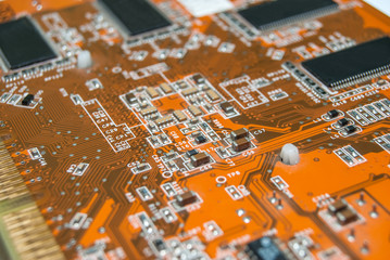 part of orange electronic board - close up