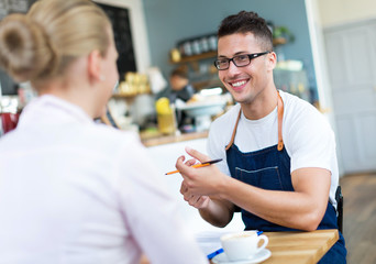 Couple working at cafe
