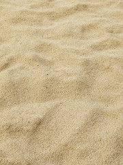 Small sand dunes on beach. Sand texture