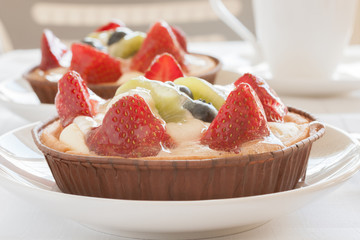 Fruit tarts filled with Strawberries Kiwi Fruit and Blueberries