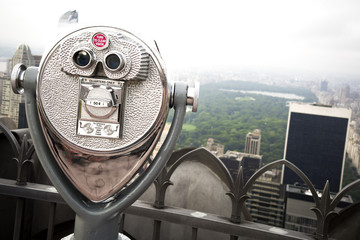 Fototapeta premium Metal coin operated binoculars overlooking Central Park in Manhattan, New York