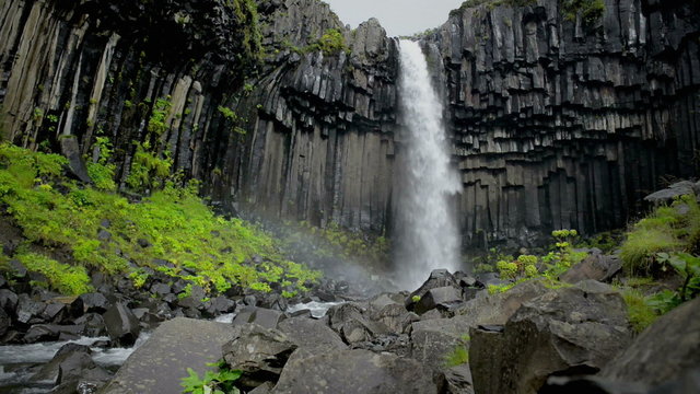 Svartifoss waterfall in Skaftafell surrounded by lava columns in Iceland.