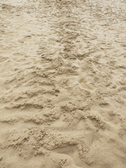 sea sand with footprints