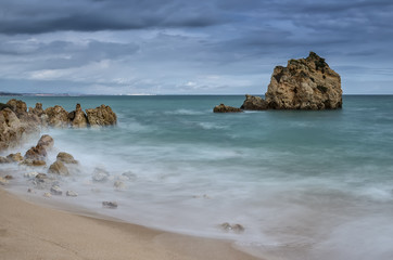 Fototapeta na wymiar Seascape before the storm. Albufeira beach Arrifes.