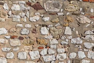 Ancient stone wall. As texture and background.