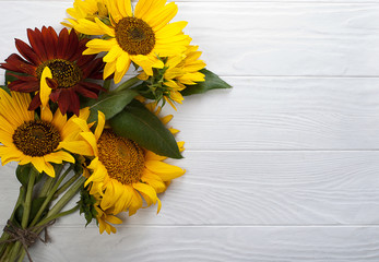 Sunflowers on a white wooden background