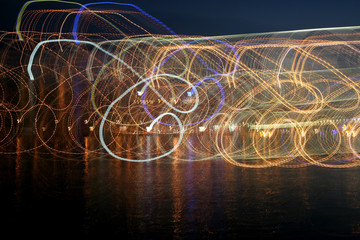 abstract colored waves of illumination in the reflection over th