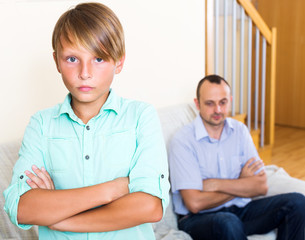 Tired man and frustrated teenager