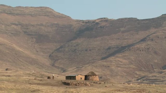 Basotho woman walking to her rural home in the Maloti mountains.