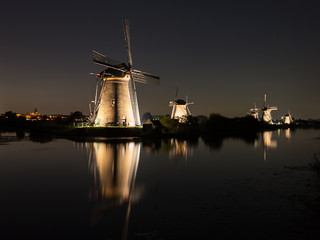Obraz premium Windmills lit at night