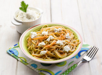 spaghetti with ricotta and carrots, selective focus