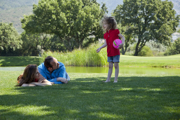 Obraz premium Happy family is enjoying at park on a weekend day