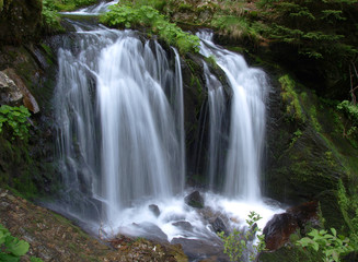 Fototapeta na wymiar Waterfall long exposure landscape image in in the Protected area Jeseniky mountains Czech republic