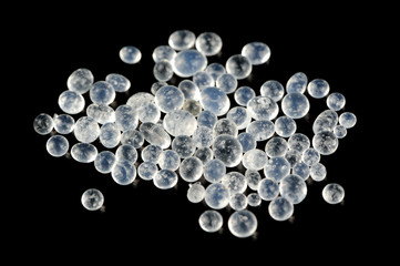 Silica Gel (Moisture Absorber) Granules on Black Background