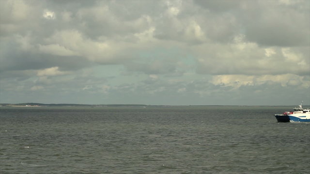 Passenger ferries passing each other on the Waddensea in The Netherlands at the end of the day.