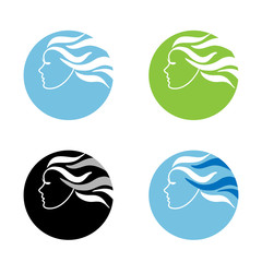 A girl in profile with long wavy hair
