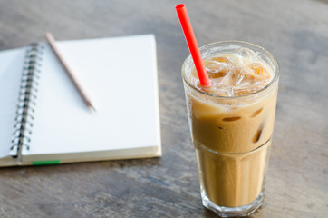 Glass Of Cold Coffee On Wood Table