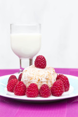 Glazed doughnut with raspberry close up