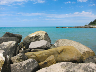 Huge rocks lie on the beach