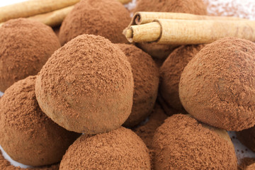 Chocolate truffles and cinnamon stick