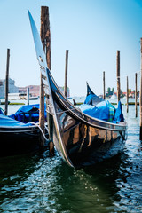 Fototapeta na wymiar Gondola in the morning in Venice, Italy. Selective focus.