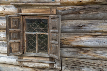 Fototapeta na wymiar A wooden wall with window