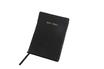 Holy Bible, gold leaf title on black simulated leather cover, closed, isolated on white. The bible...