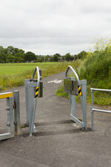 Motorcycle restrictor barrier sited on a semi-urban cycle and footpath with the aim of preventing motorcycles from gaining unauthorized access.