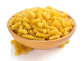 fusilli pasta in bowl isolated on white