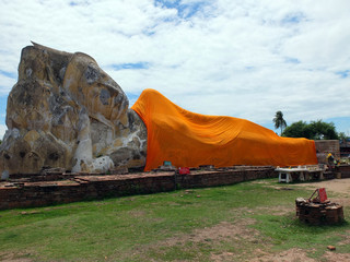Reclining Buddha at Wat Phranon Old Temple with blue sky in Ayut