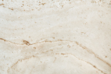 Cream colored marble patterned texture background