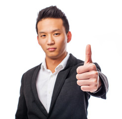 Fototapeta na wymiar portrait of a young asian man with thumb up