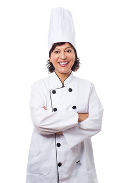portrait of a mature woman wearing like a chef posing on a white background