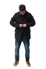 Fototapeta premium full body young man buttoning a button