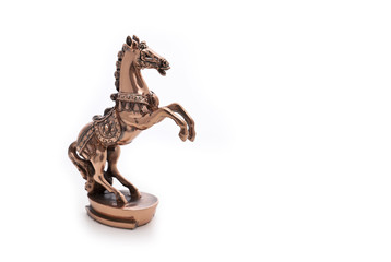 bronze horse figurine on a white background
