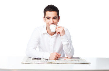 man drinking coffee on table