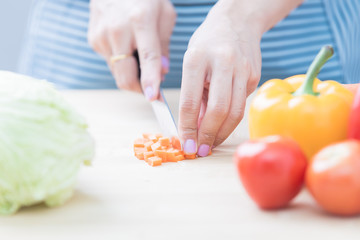 Salad preparation - cutting fresh vegetables into pieces
