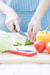 Salad preparation - cutting fresh vegetables into pieces