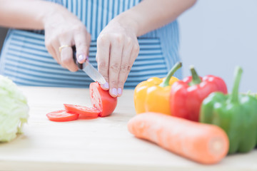 Salad preparation - cutting fresh vegetables into pieces