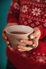 Female Holding A Cup