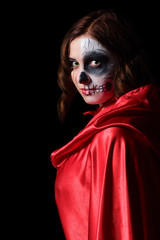 Halloween witch. Portrait on black background. Dark gothic makeup.