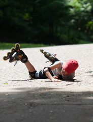Little rollerblader takes a tumble