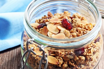 Granola with nuts,seed mix and dried cranberries. Selective focus, toned image 